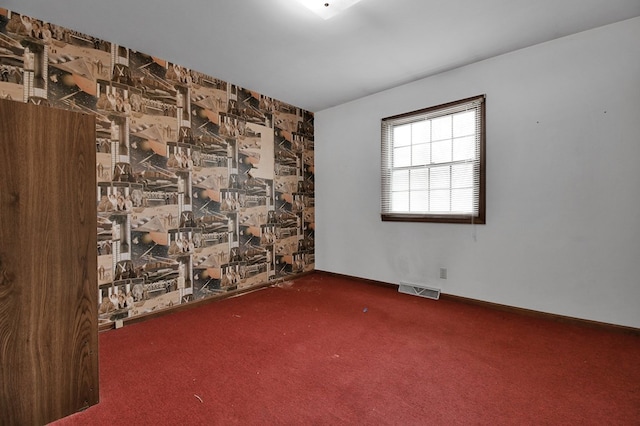 unfurnished room with carpet