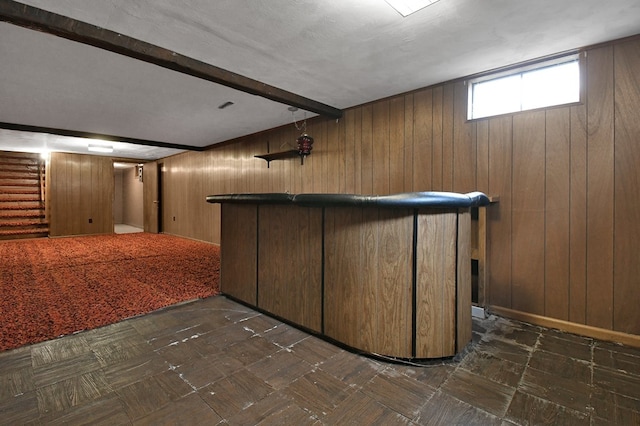 bar with wooden walls and beam ceiling