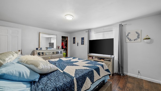 bedroom with dark hardwood / wood-style flooring