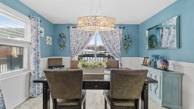 dining area with an inviting chandelier