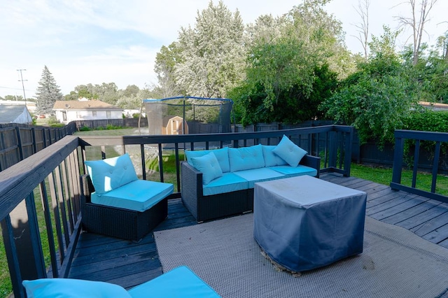 wooden deck featuring an outdoor living space