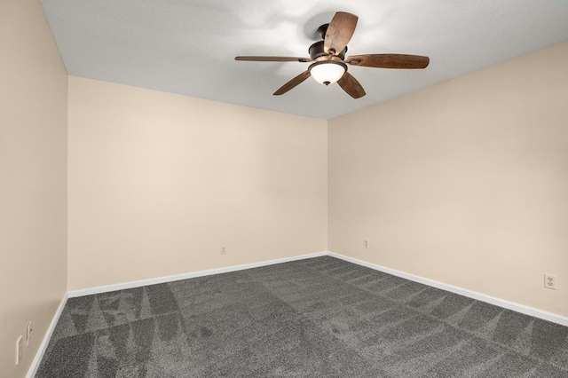 828 Longmeadow Ln, Findlay, OH 45840 - spare room featuring dark carpet, ceiling fan, and baseboards