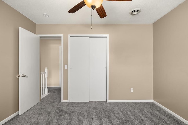 828 Longmeadow Ln, Findlay, OH 45840 - unfurnished bedroom featuring carpet, a closet, baseboards, and a ceiling fan