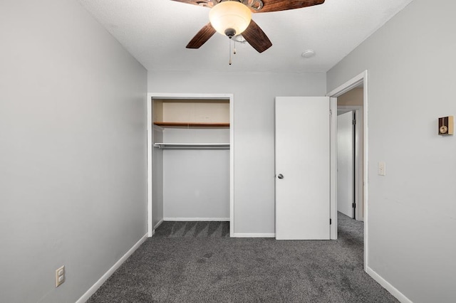 828 Longmeadow Ln, Findlay, OH 45840 - unfurnished bedroom with dark carpet, a closet, ceiling fan, and baseboards