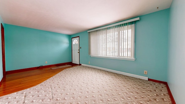 empty room with light hardwood / wood-style floors