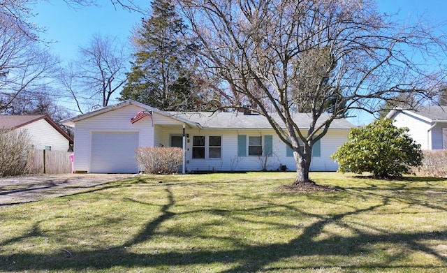 ranch-style house featuring a front yard, a garage, and fence