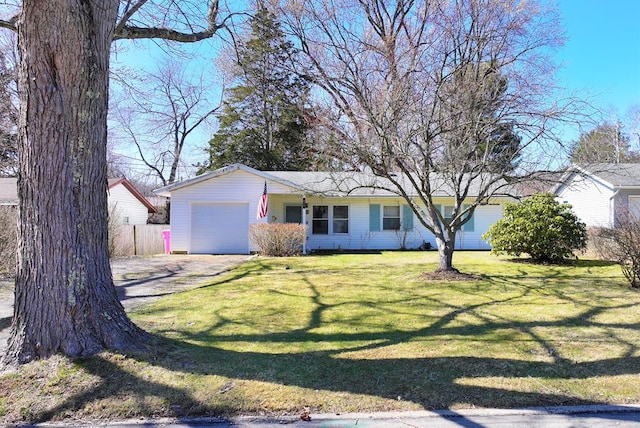 single story home with a front lawn, an attached garage, fence, and driveway