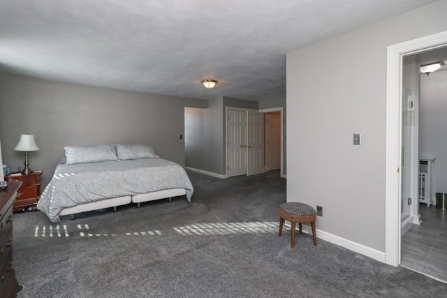 carpeted bedroom with baseboards