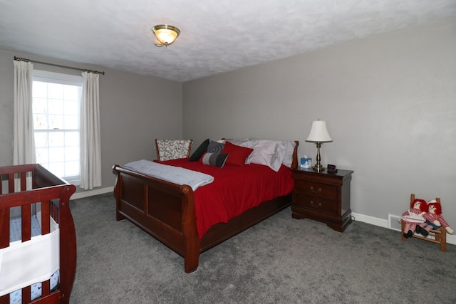 carpeted bedroom featuring baseboards
