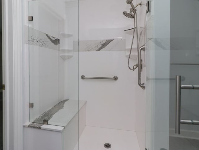 full bathroom featuring a shower stall