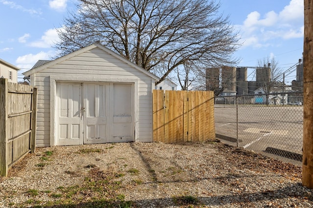 view of shed with fence private yard