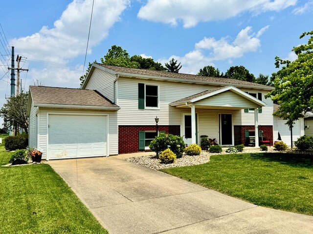 71 Taft St, Shelby, OH 44875 - view of front of property with a garage, driveway, brick siding, and a front yard