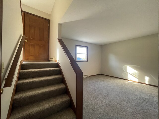 71 Taft St, Shelby, OH 44875 - stairs with carpet floors, a baseboard heating unit, and baseboards