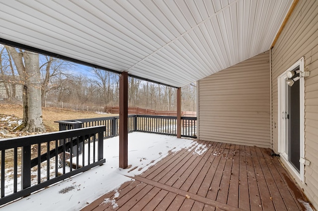 snow covered deck with fence