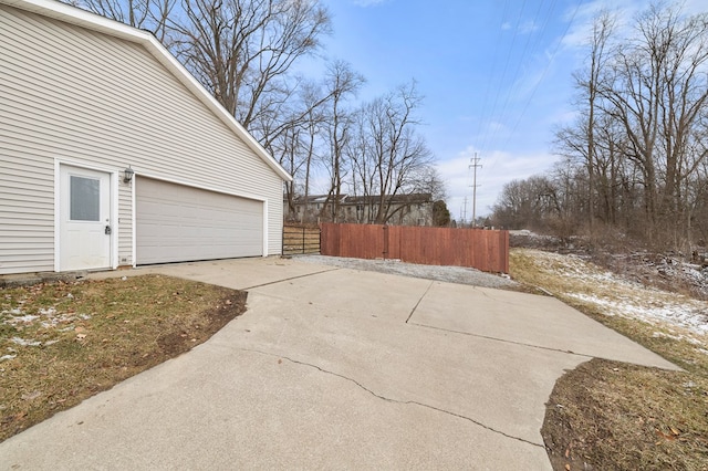 exterior space with a garage and fence