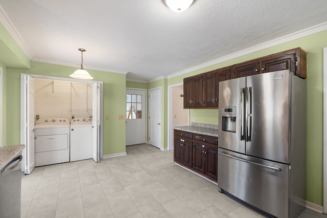 kitchen featuring stainless steel appliances, dark brown cabinets, washing machine and dryer, and crown molding