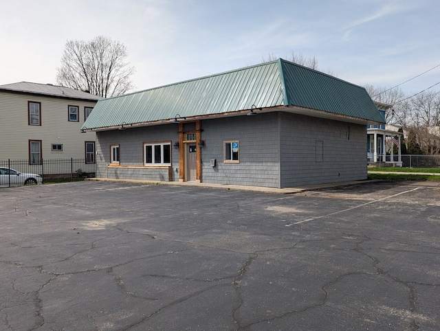 115 N Main St, Mount Gilead, OH 43338 - view of property featuring fence and uncovered parking