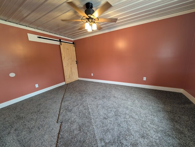 115 N Main St, Mount Gilead, OH 43338 - unfurnished room featuring dark carpet, baseboards, a barn door, and ceiling fan