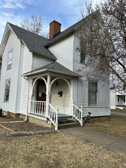 106 E Marion St, Mount Gilead, OH 43338 - view of front of home featuring a chimney and a porch