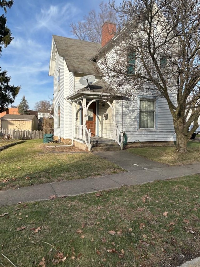 106 E Marion St, Mount Gilead, OH 43338 - view of front of house with a chimney and a porch