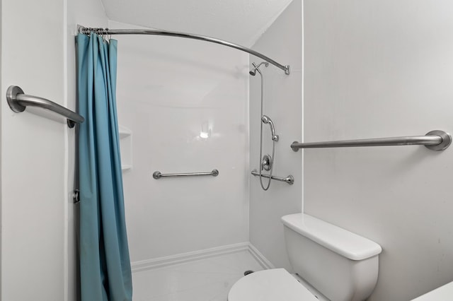 bathroom with toilet and curtained shower