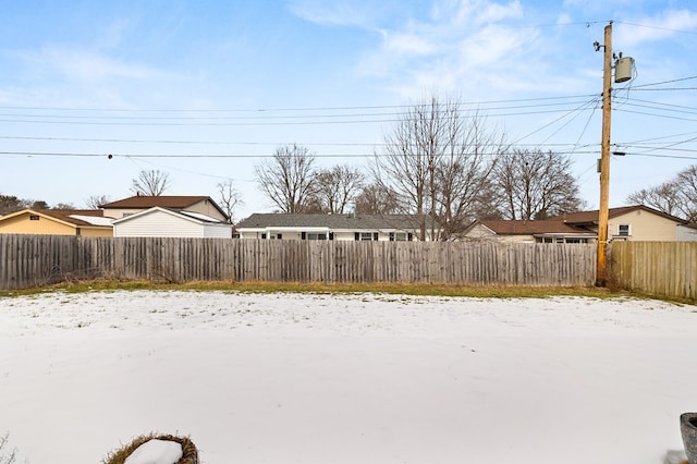 view of yard covered in snow