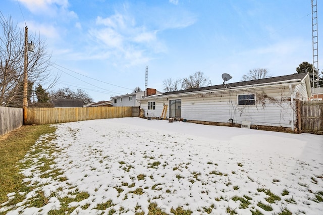 view of snow covered house