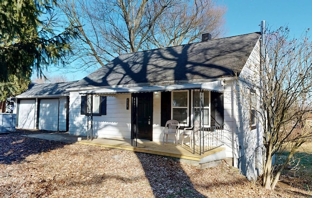 view of front facade with a garage and covered porch