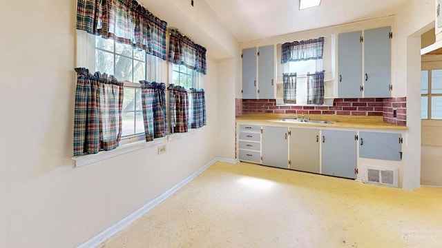 729 Keen Ave, Ashland, OH 44805 - kitchen featuring baseboards, light countertops, and a sink