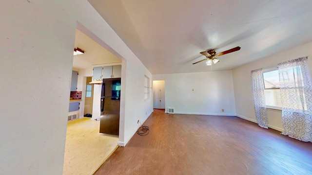 729 Keen Ave, Ashland, OH 44805 - unfurnished living room with a ceiling fan, baseboards, and wood finished floors