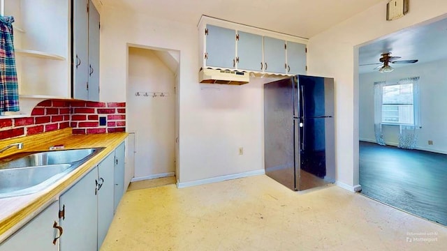 729 Keen Ave, Ashland, OH 44805 - kitchen with a sink, freestanding refrigerator, ceiling fan, and baseboards