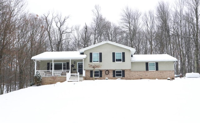 tri-level home featuring covered porch