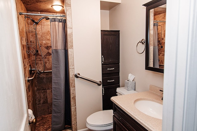 bathroom with toilet, vanity, and walk in shower