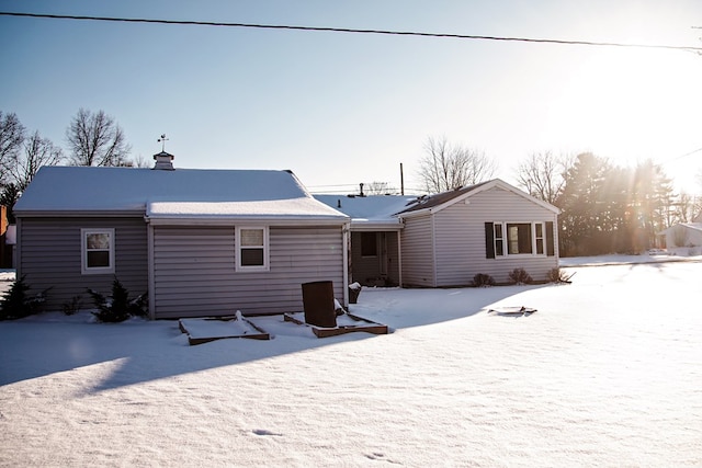 view of snow covered house