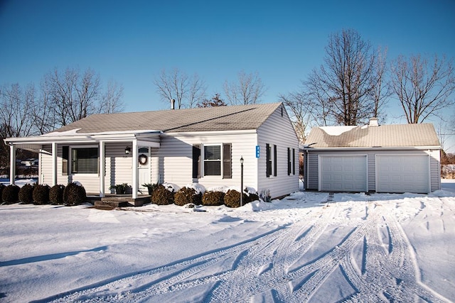 single story home with covered porch and a garage