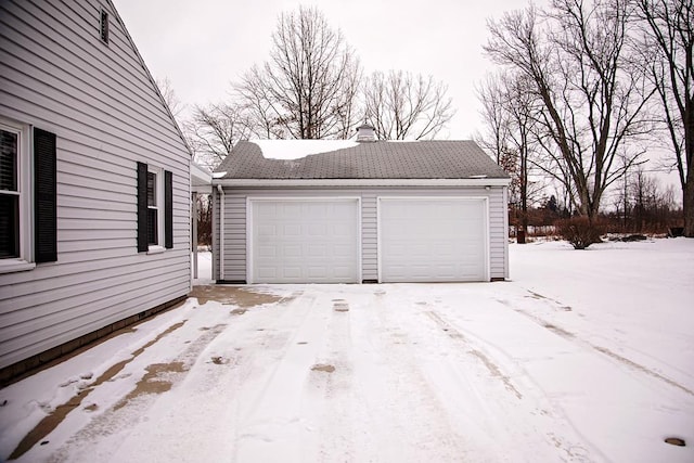 view of snow covered garage