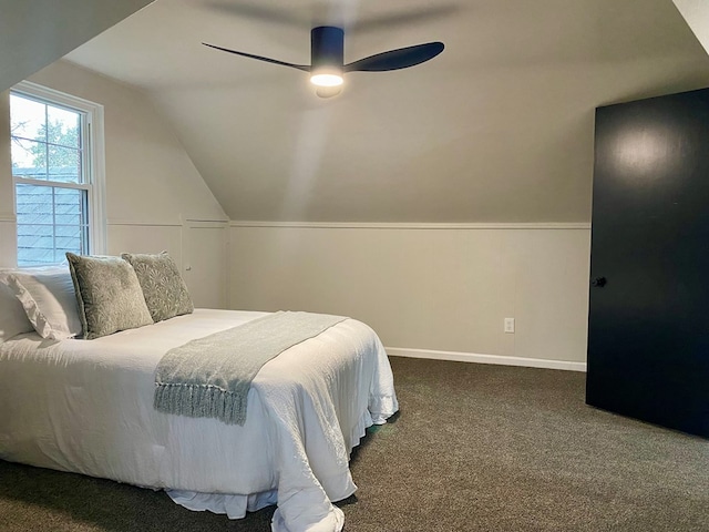 bedroom with baseboards, lofted ceiling, a ceiling fan, and carpet flooring