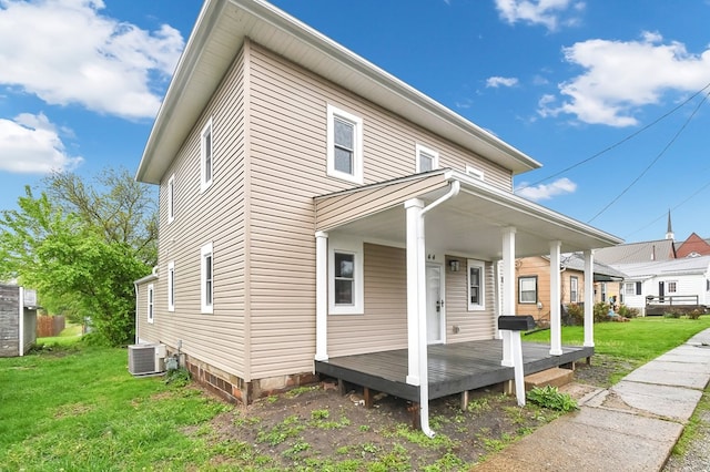 44 W 4th St, Fredericktown, OH 43019 - view of front of property featuring a front lawn, central air condition unit, and a porch