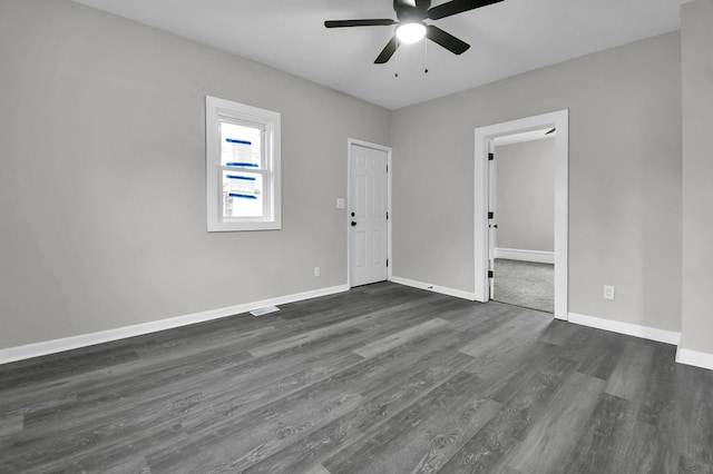 44 W 4th St, Fredericktown, OH 43019 - unfurnished room with ceiling fan, dark wood-style flooring, and baseboards