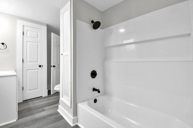 44 W 4th St, Fredericktown, OH 43019 - bathroom featuring bathtub / shower combination, wood finished floors, toilet, and a closet