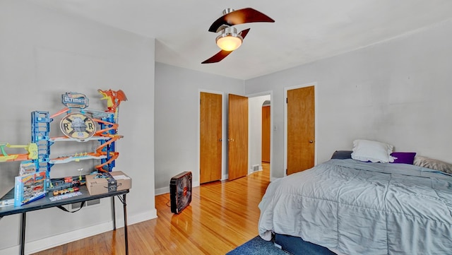 bedroom featuring hardwood / wood-style flooring and ceiling fan