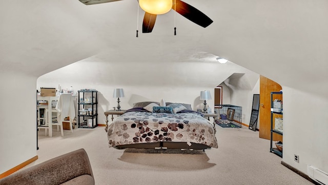 bedroom with light colored carpet, vaulted ceiling, and ceiling fan