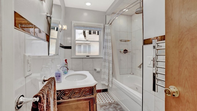 bathroom featuring vanity and shower / bath combination with curtain