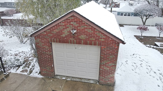 view of snow covered garage