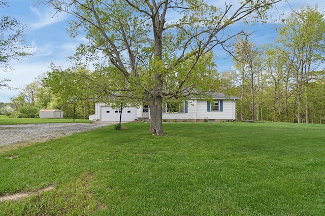 view of front of house featuring dirt driveway, a front yard, a shed, and an attached garage