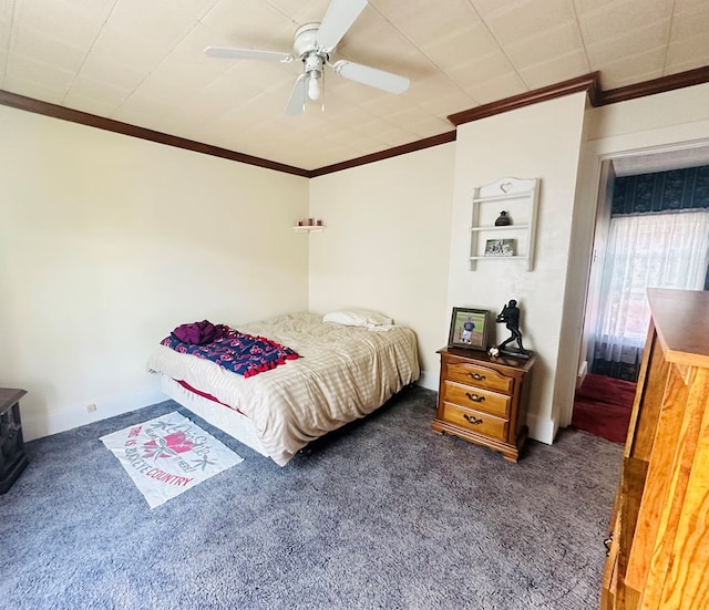 carpeted bedroom with ceiling fan and crown molding