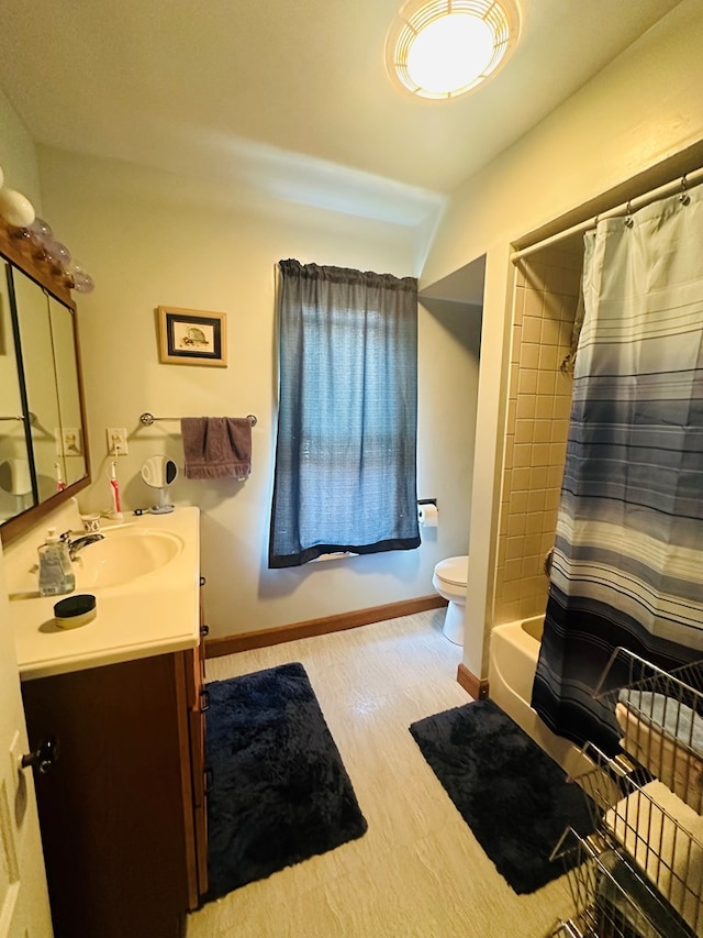 full bathroom with hardwood / wood-style flooring, shower / bath combo with shower curtain, vanity, and toilet