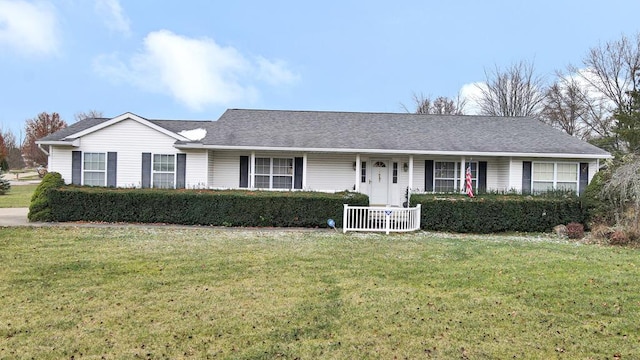 ranch-style home featuring a front yard