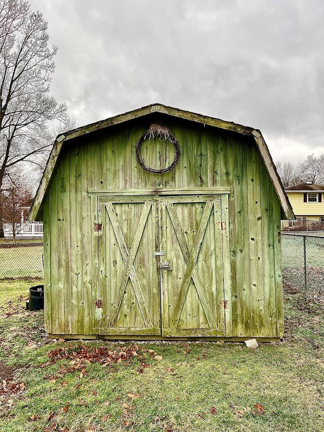 view of outbuilding with a lawn