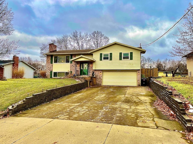 view of front of house with a garage and a front yard